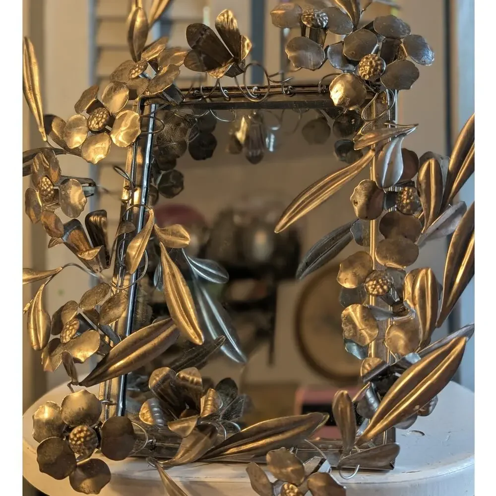 Vintage handcrafted silver-toned floral toleware mirror